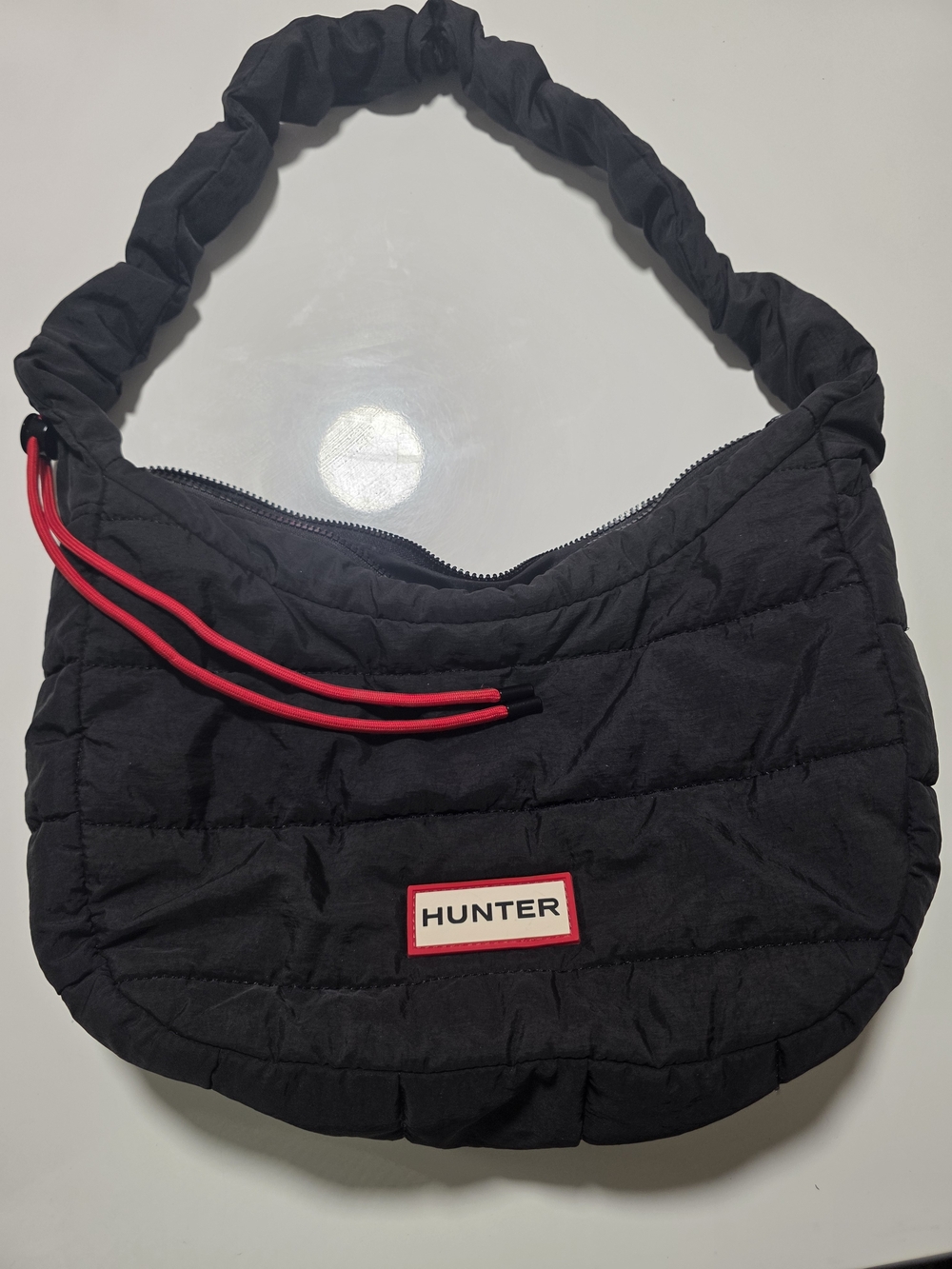 Hunter Black Quilted Shoulder Bag with Red Accents